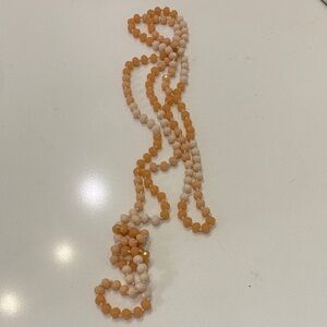 Elegant Beaded Necklace in Peach and Cream